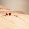 Boucles d'oreilles fantaisie chaînette longue et étoile sur le lobe