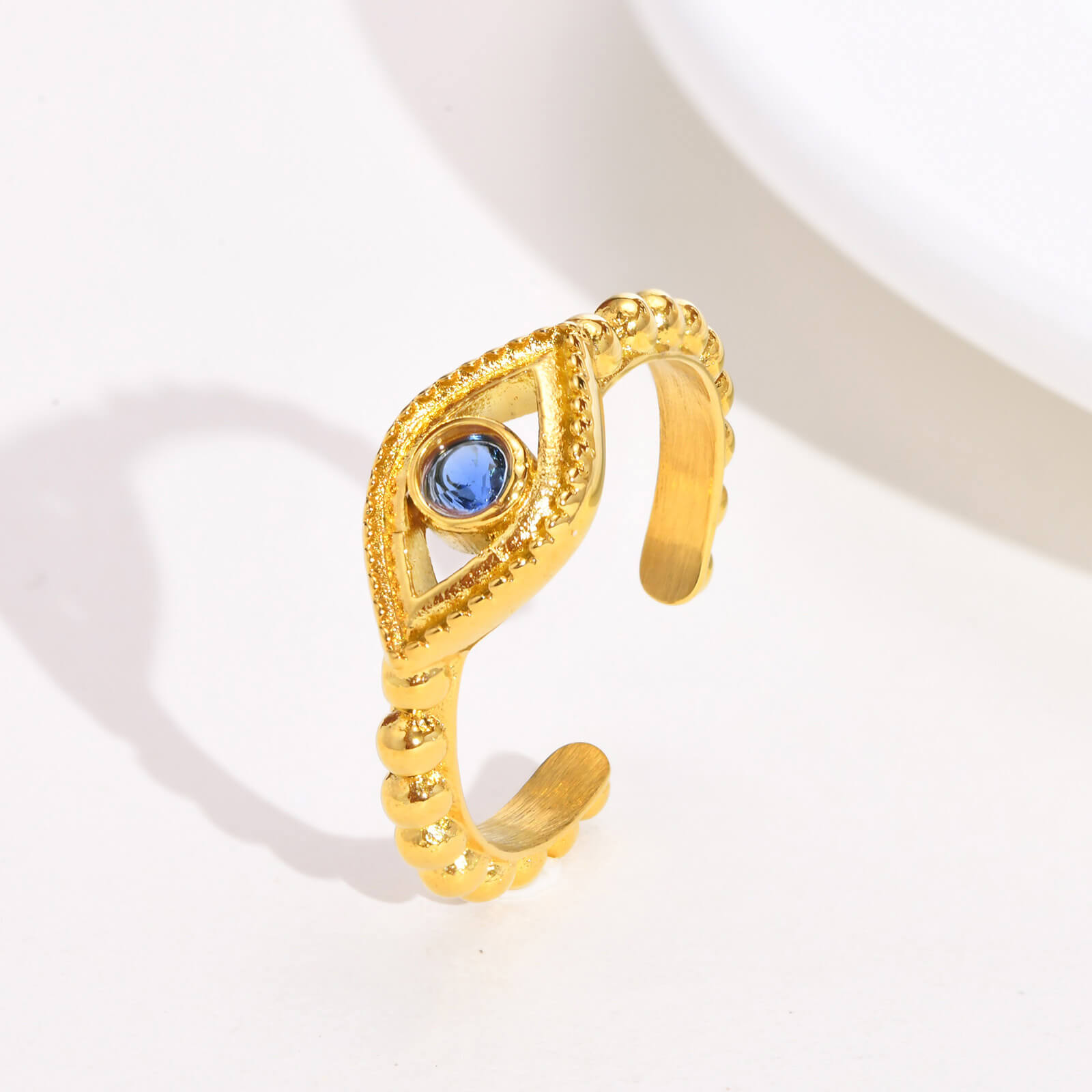 Bague fantaisie dorée oeil bleu oxyde de zirconium